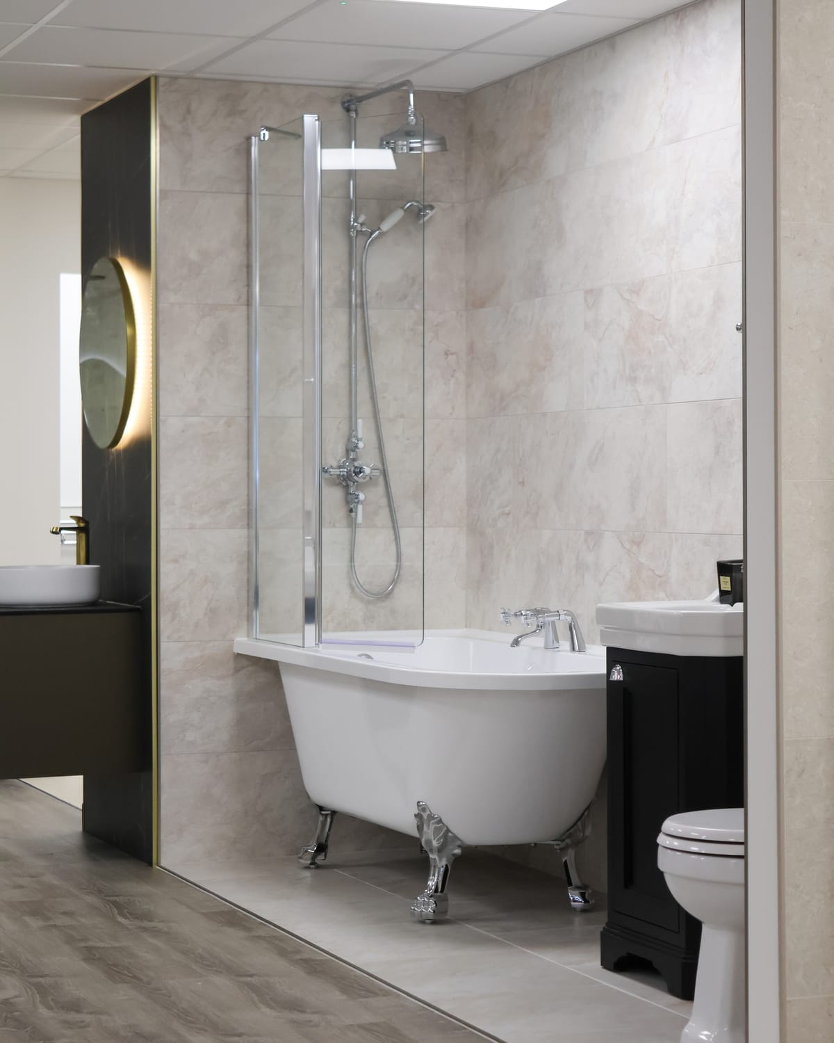 Roll-top shower bath with chrome claw feet, thermostatic shower and traditional vanity unit at Pochin Eastbourne